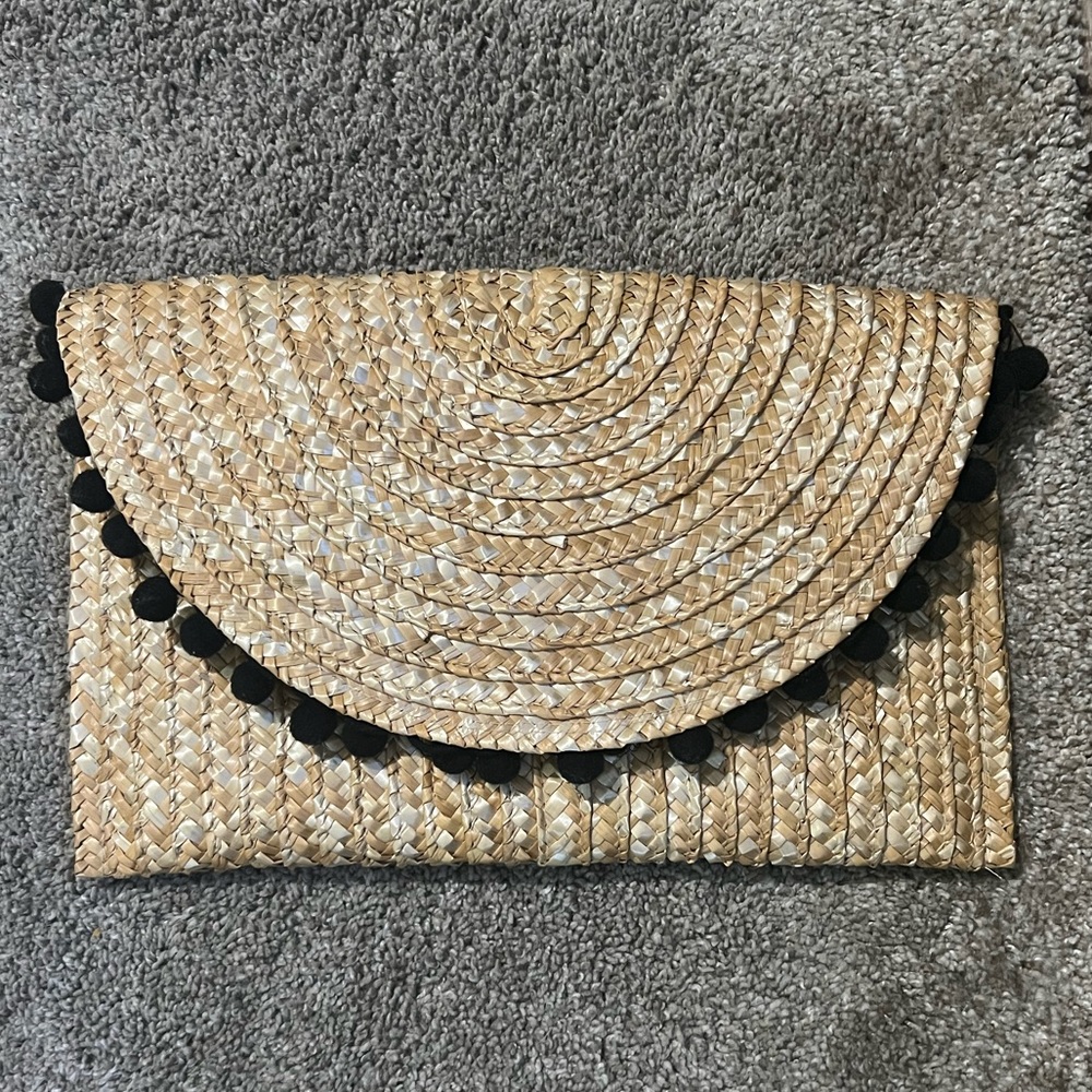 shiraleah straw clutch with black pom poms